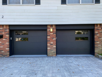black flush steel garage door with mosaic windows