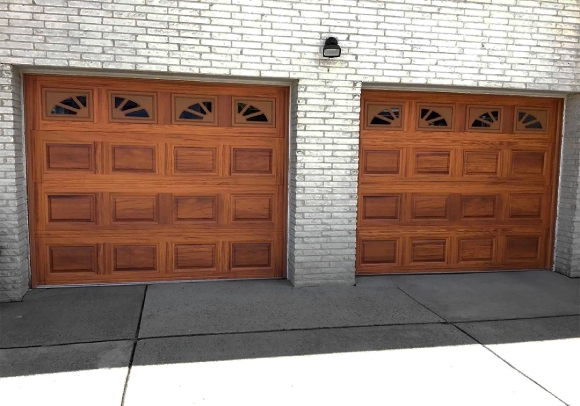 Short raised panel garage doors in woodtone